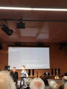 two people in front of a screen
